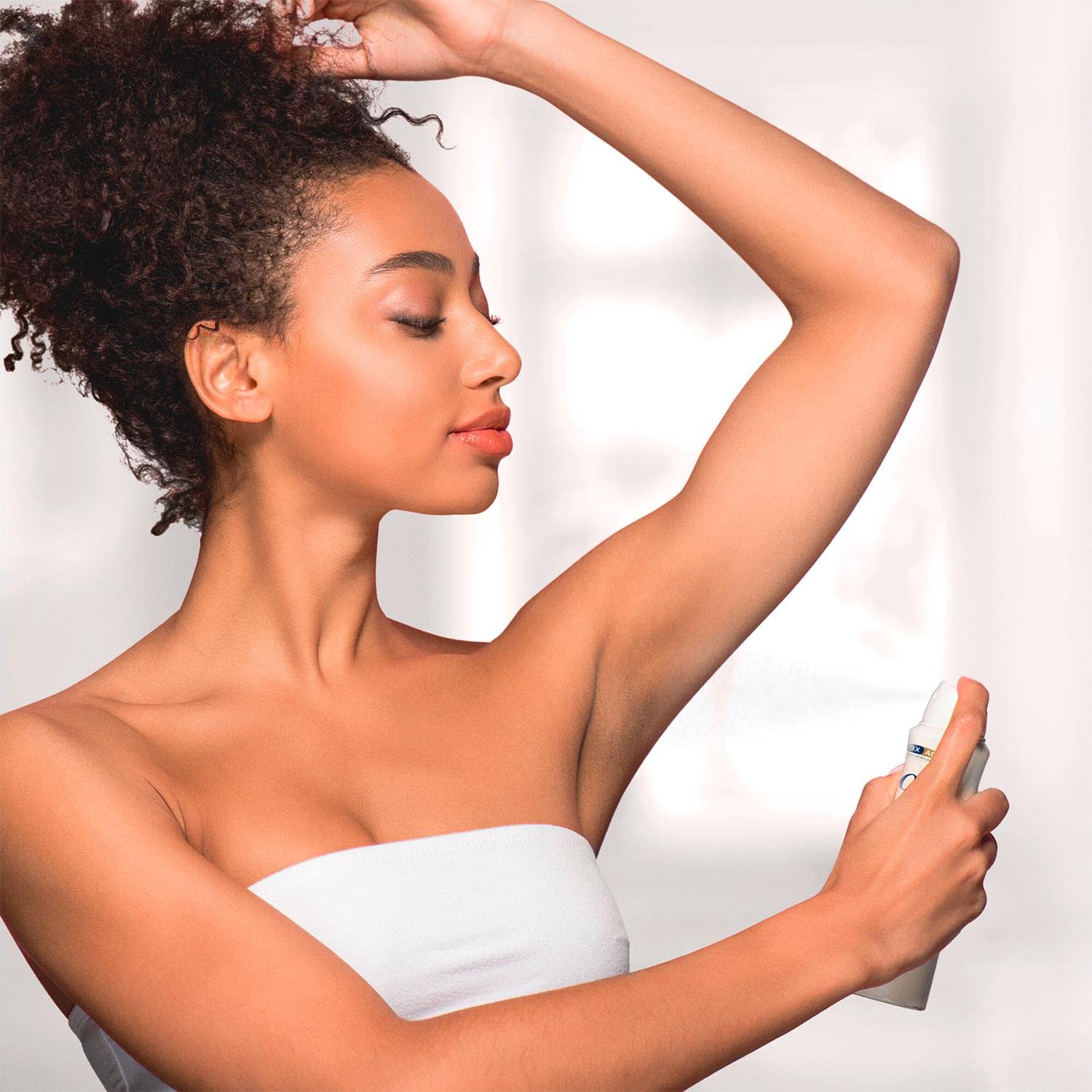 Dove Invisible Dry spray bottle ready for quick-dry use