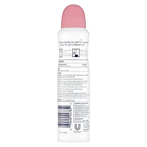 Applying Dove Rose Petals dry spray underarm for quick-dry feel