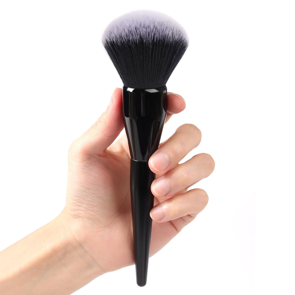 dpolla Large Powder Brush blending close-up for a natural finish.