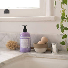 Dr. Bronner's Tea Tree bottle for gentle cleansing with a crisp, earthy scent.