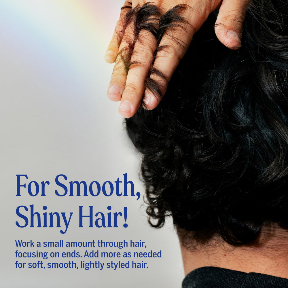 Damp hair being styled with Dr. Bronner's Peppermint Creme for defined texture.