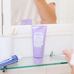 Close-up of Dr. Bronner’s shaving soap lather showing creamy texture