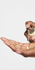 Hands applying Dr. Hauschka Revitalizing Day Lotion for quick absorption.