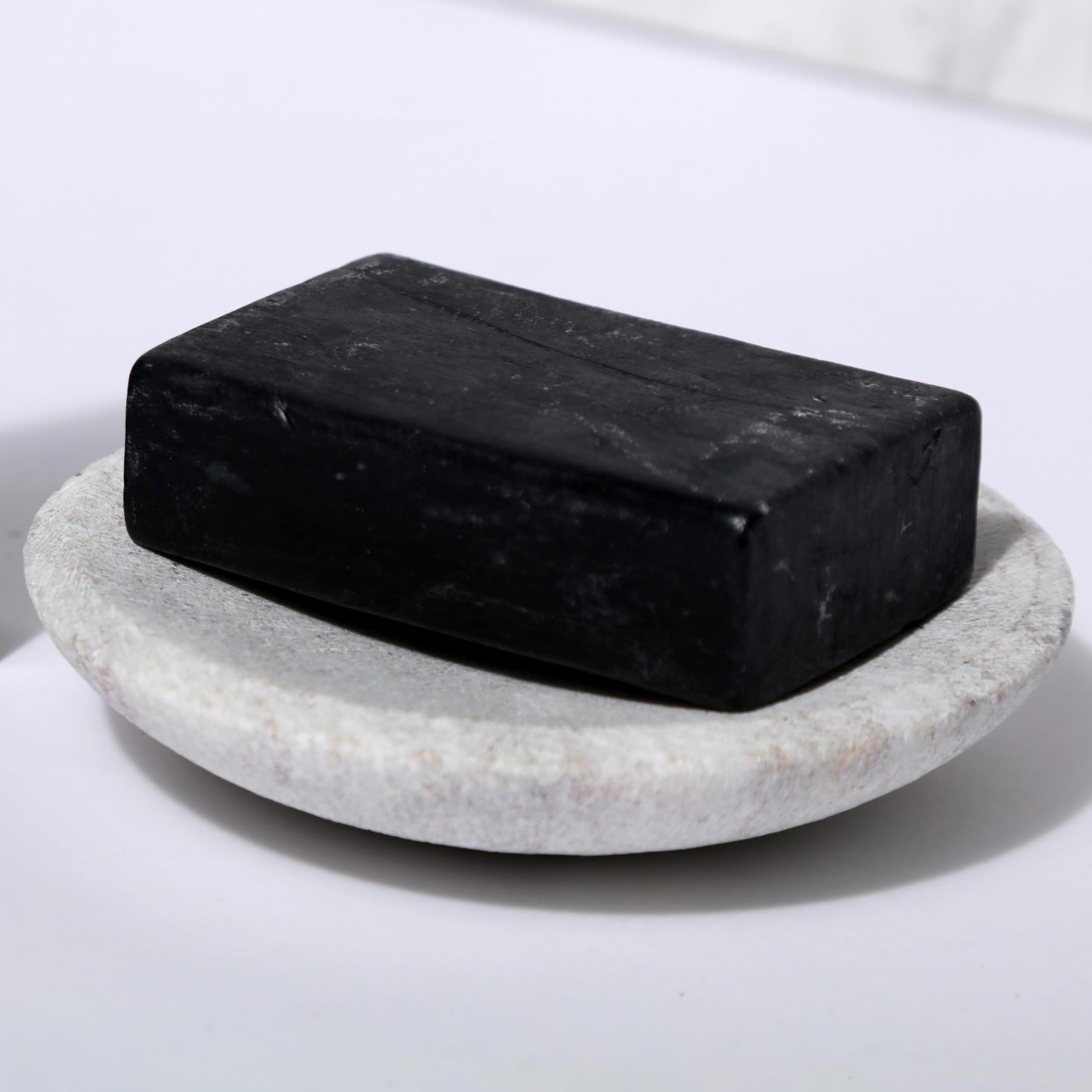 Dr Natural Black Bar Soap versatile for laundry and cleansing.