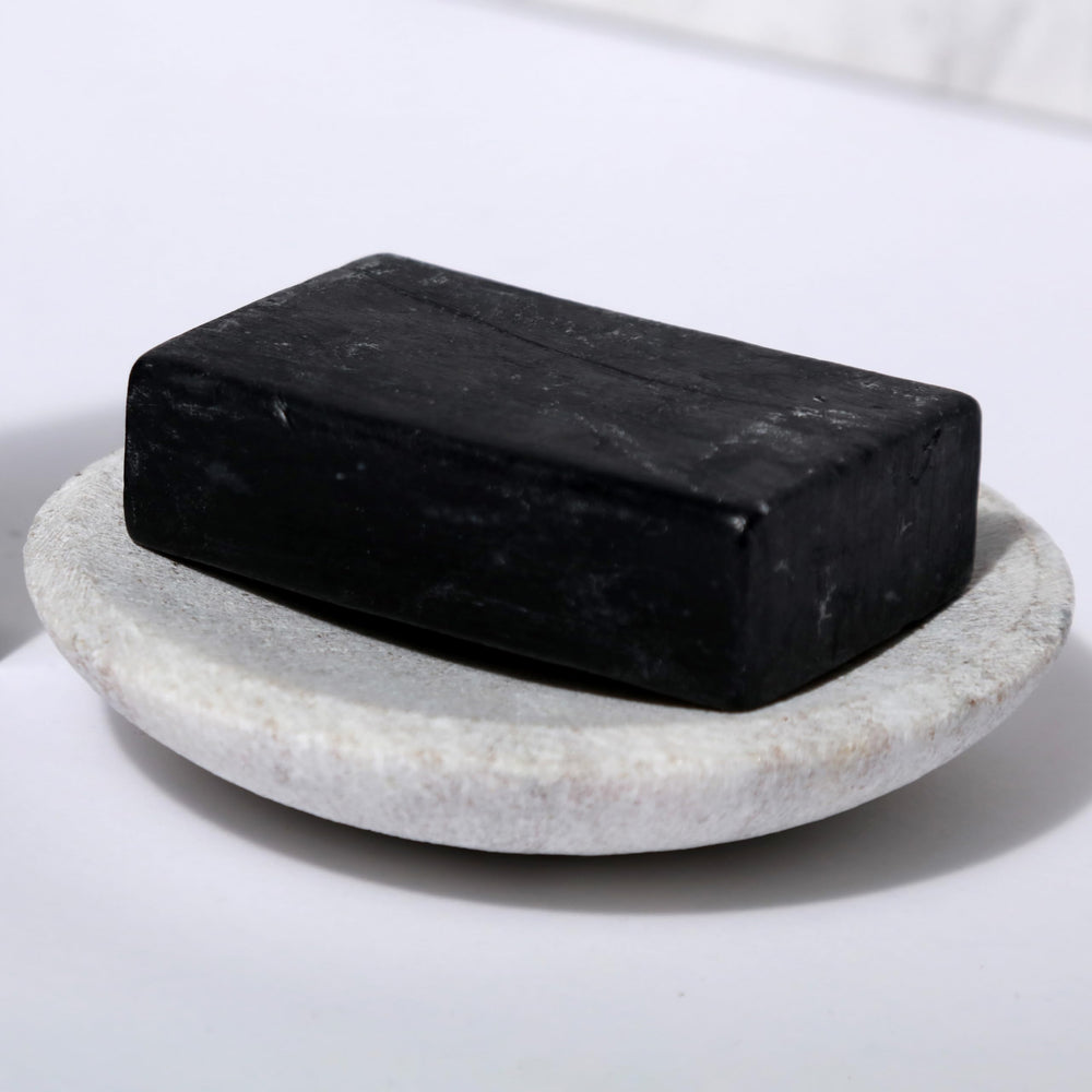 Dr Natural Black Bar Soap versatile for laundry and cleansing.