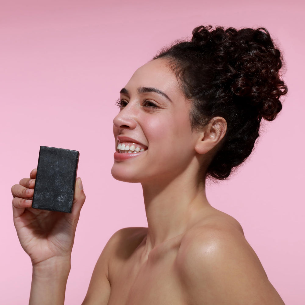 Dr Natural Black Bar Soap multi-use for body hands and face.