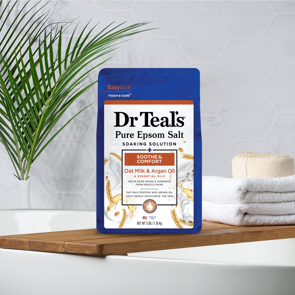 Measuring two cups of Dr Teal's Epsom Salt for bath time