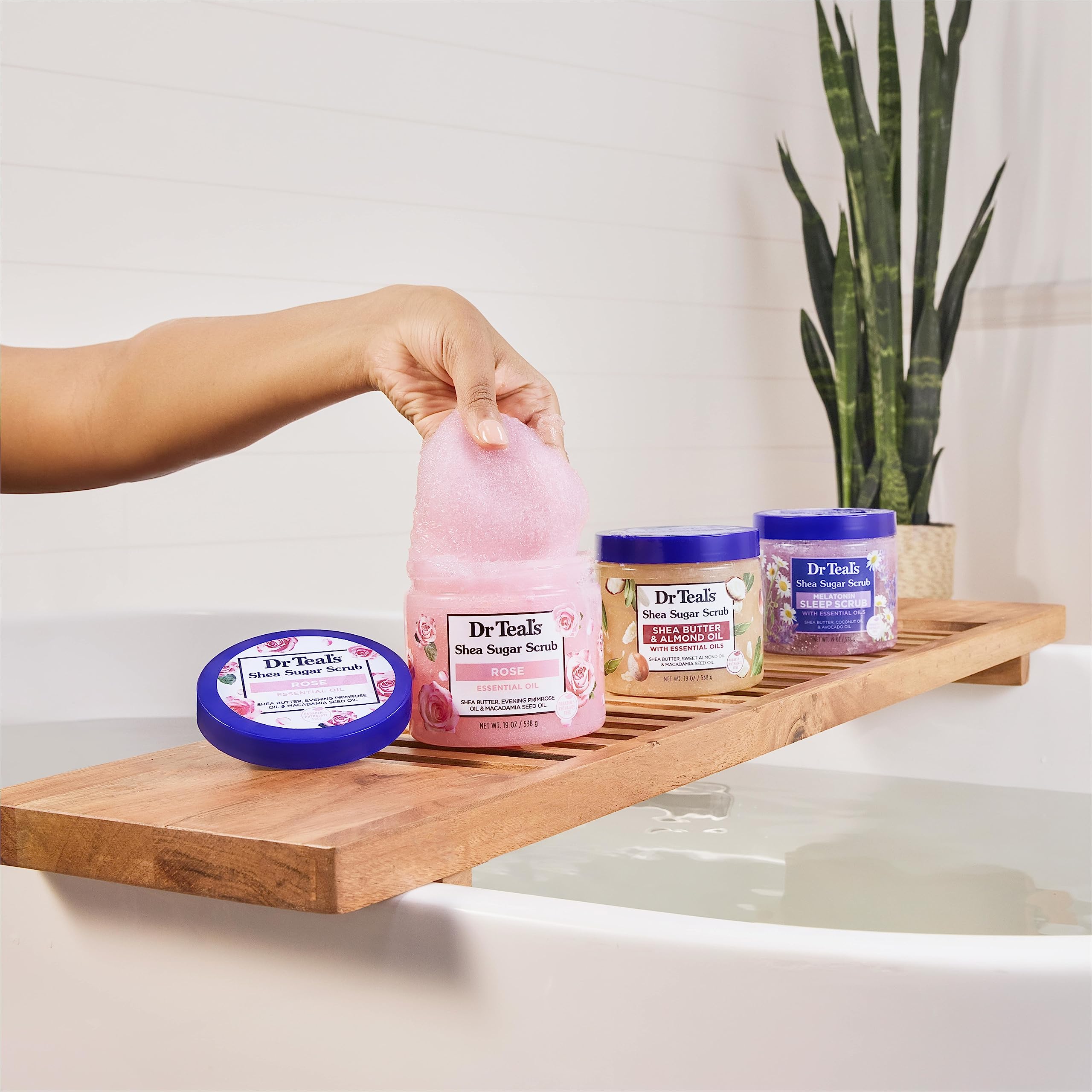 Dr Teal's Shea Sugar Body Scrub application scene demonstrates massaging rough skin.