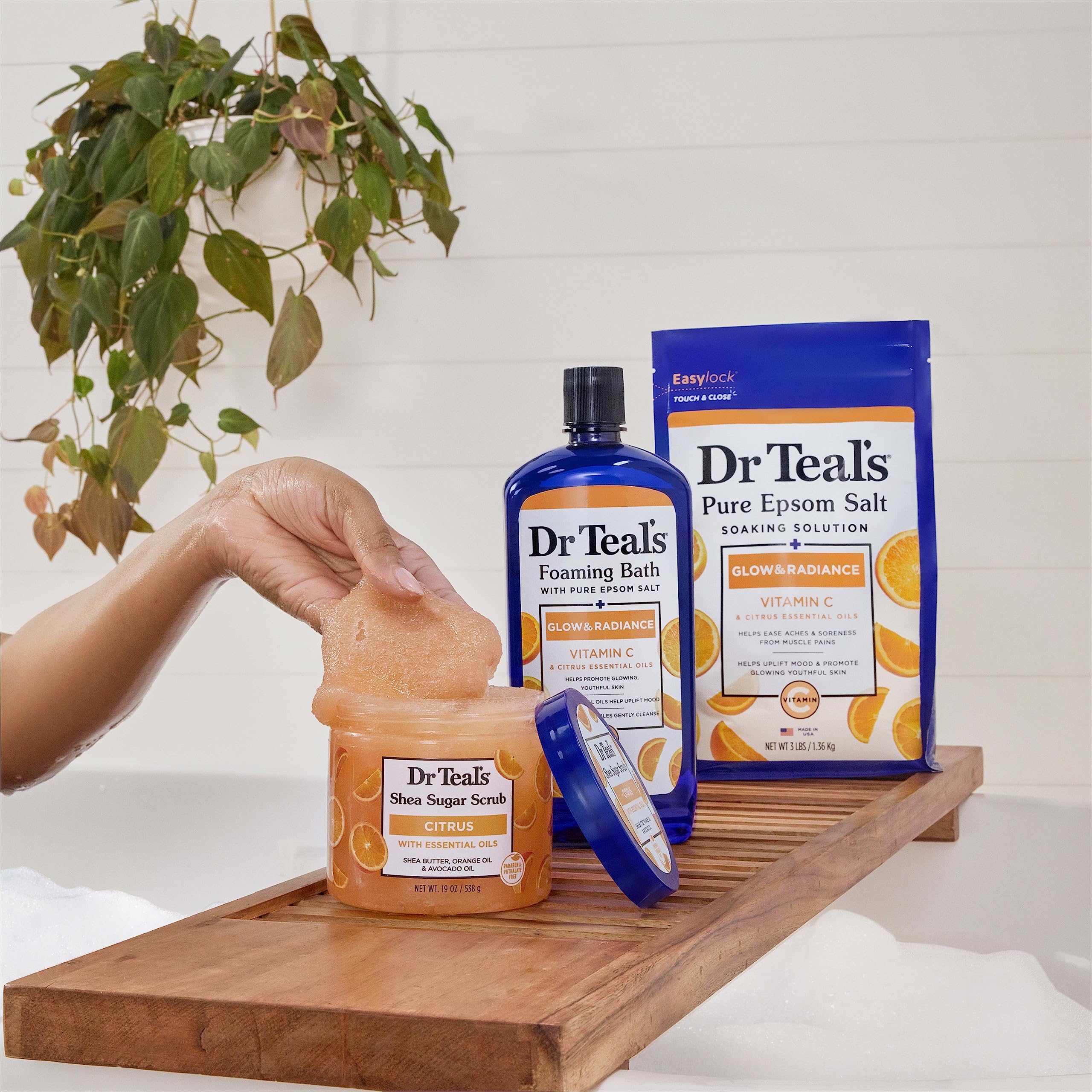 Dr Teal's Citrus Scrub hand application close-up shows exfoliation action.