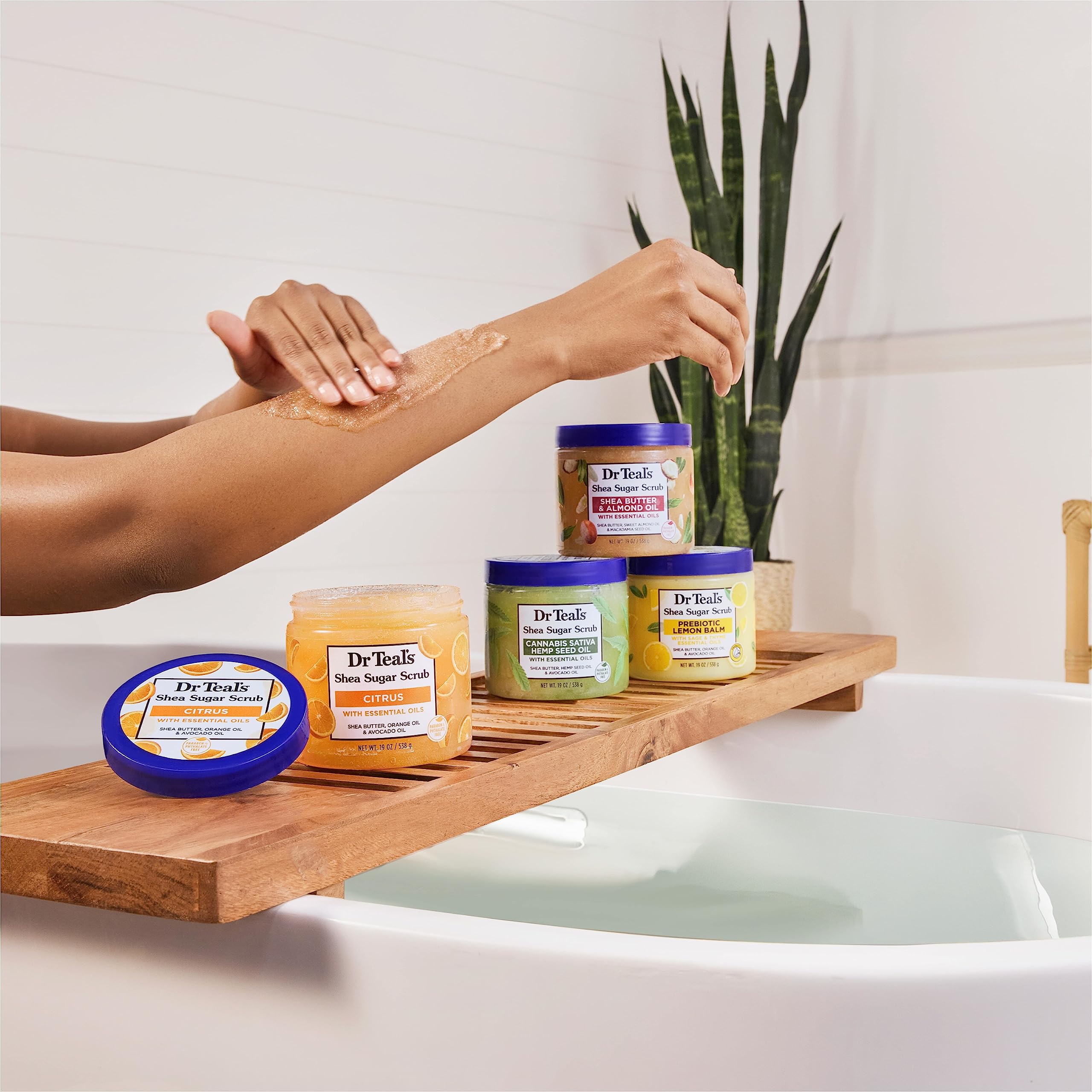 Dr Teal's Shea Sugar Body Scrub massage action indicates exfoliation in motion.