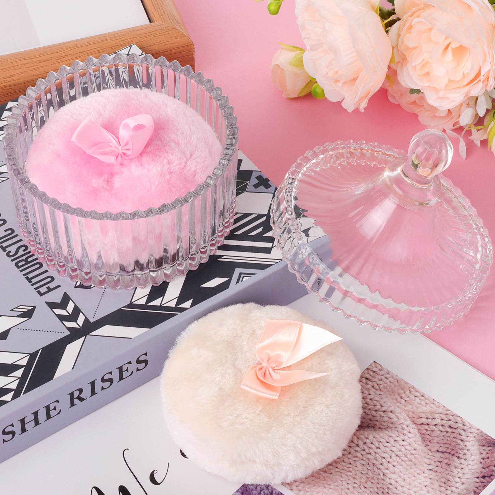 Draupnir large dusting puff in use for body powder.