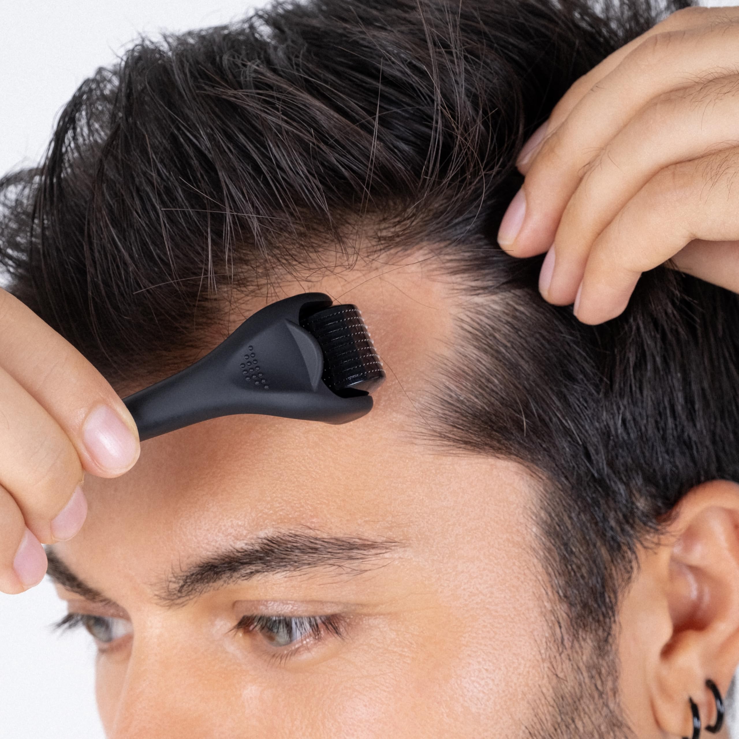 Dremenester Derma Roller in use with multi-directional passes