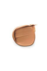 Applying Dr. Hauschka tinted day cream to the face with gentle pressure.