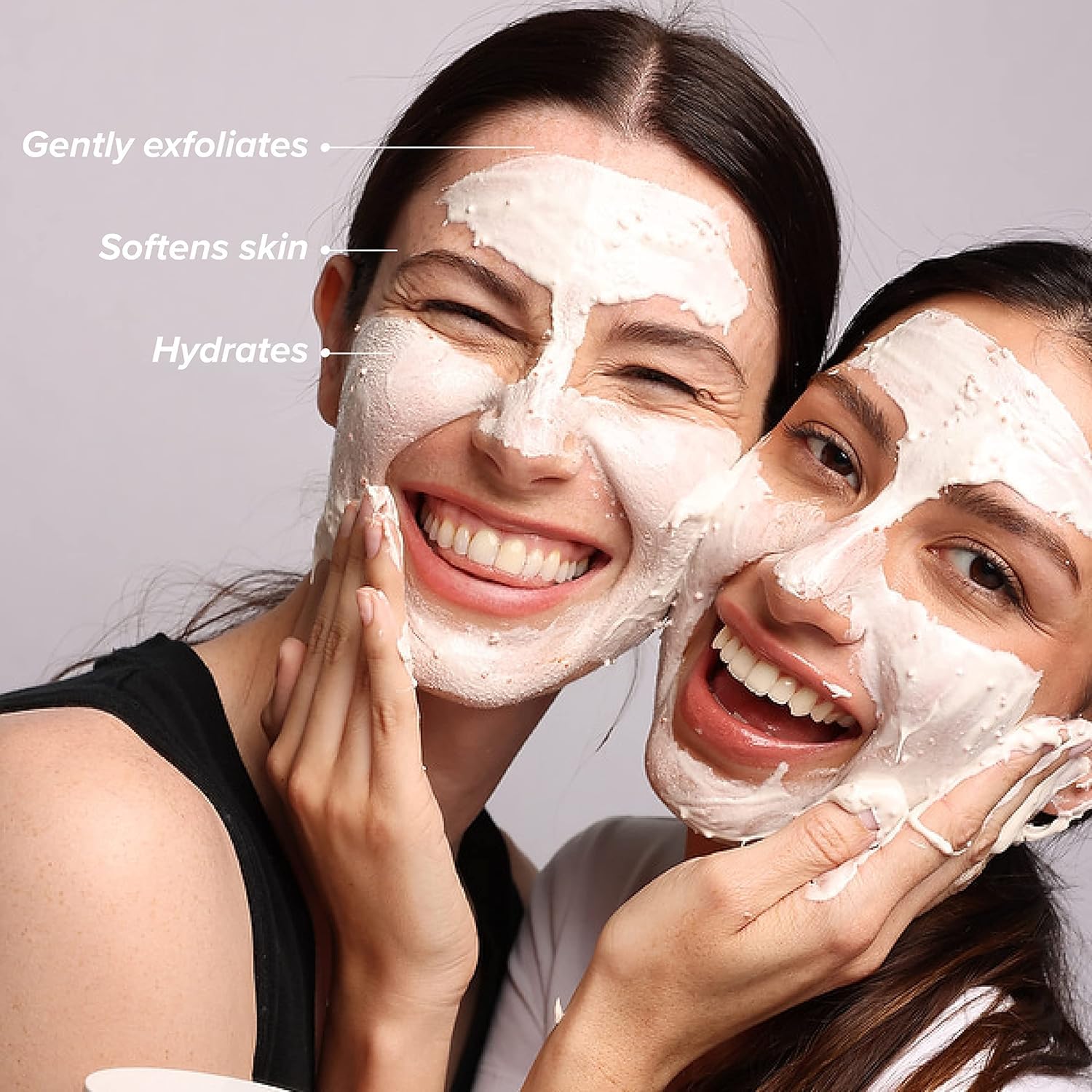 Spreading DRMTLGY mask on skin for smooth, even application