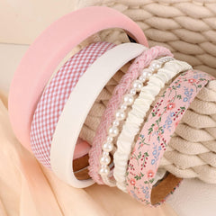 Drnytunk pearl embellishment headband showcases subtle sparkle for parties.