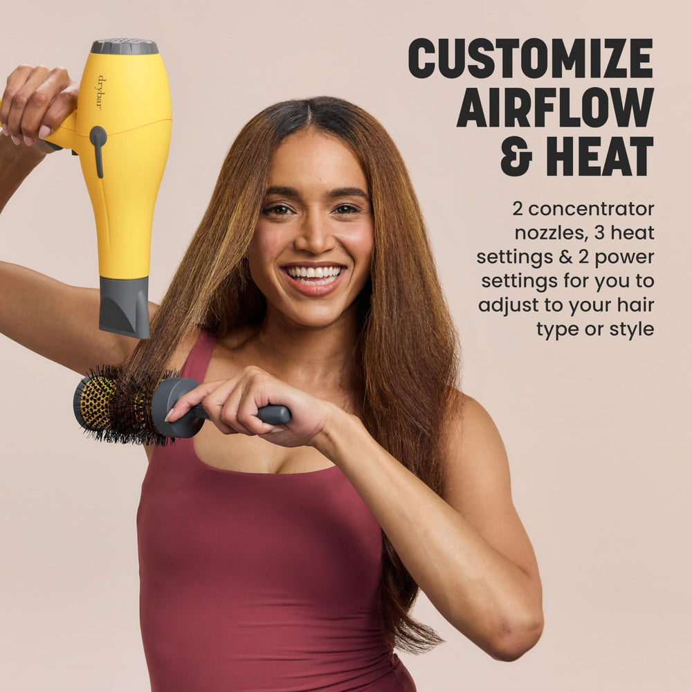 Drybar Buttercup blow dryer side view highlighting ergonomic grip for extended use