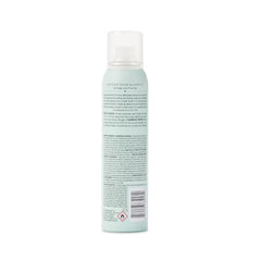 Drybar Detox Dry Shampoo Spray at roots for instant lift and texture.