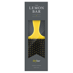 Drybar Lemon Bar Paddle Brush close-up shows flexible bristles for gentle detangling.