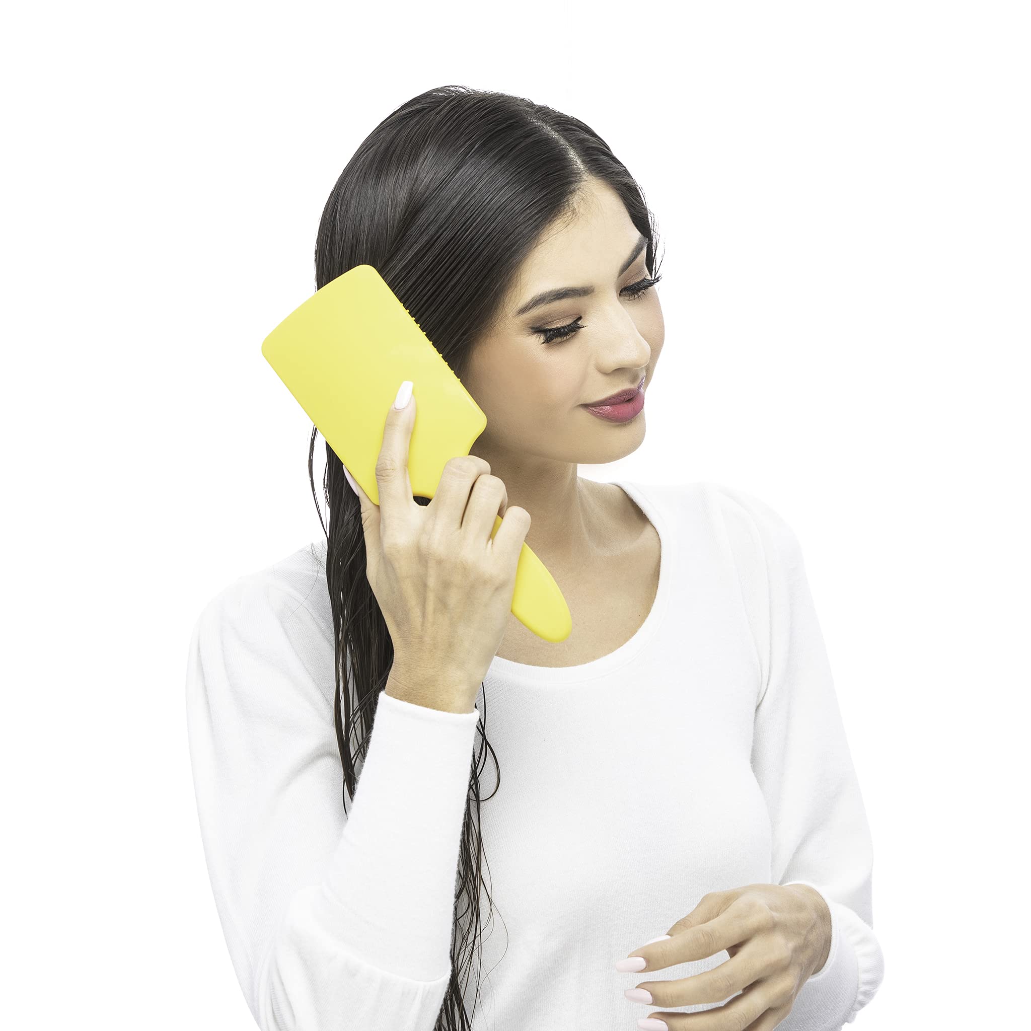 Drybar Lemon Bar Paddle Brush cushioned body enables gentle styling.