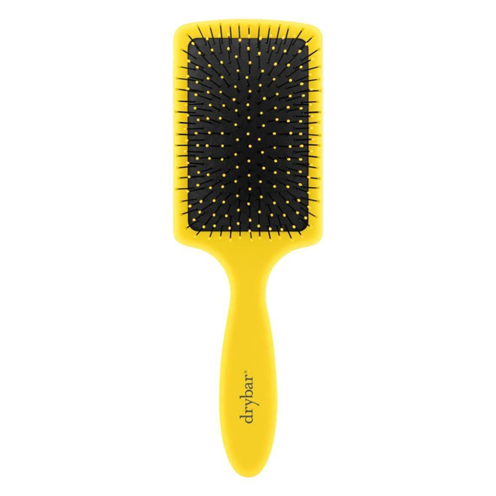 Drybar Lemon Bar Paddle Brush front view with a comfortable grip for steady styling.
