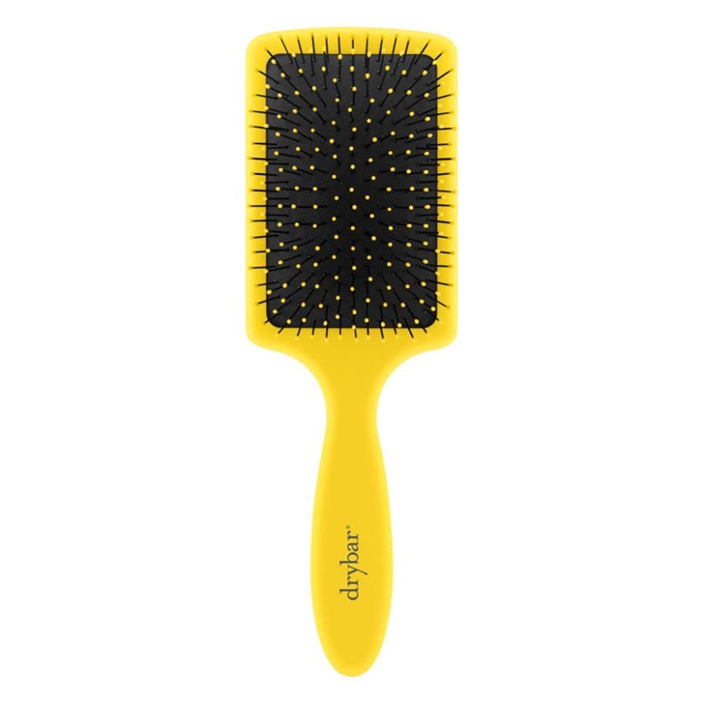 Drybar Lemon Bar Paddle Brush front view with a comfortable grip for steady styling.