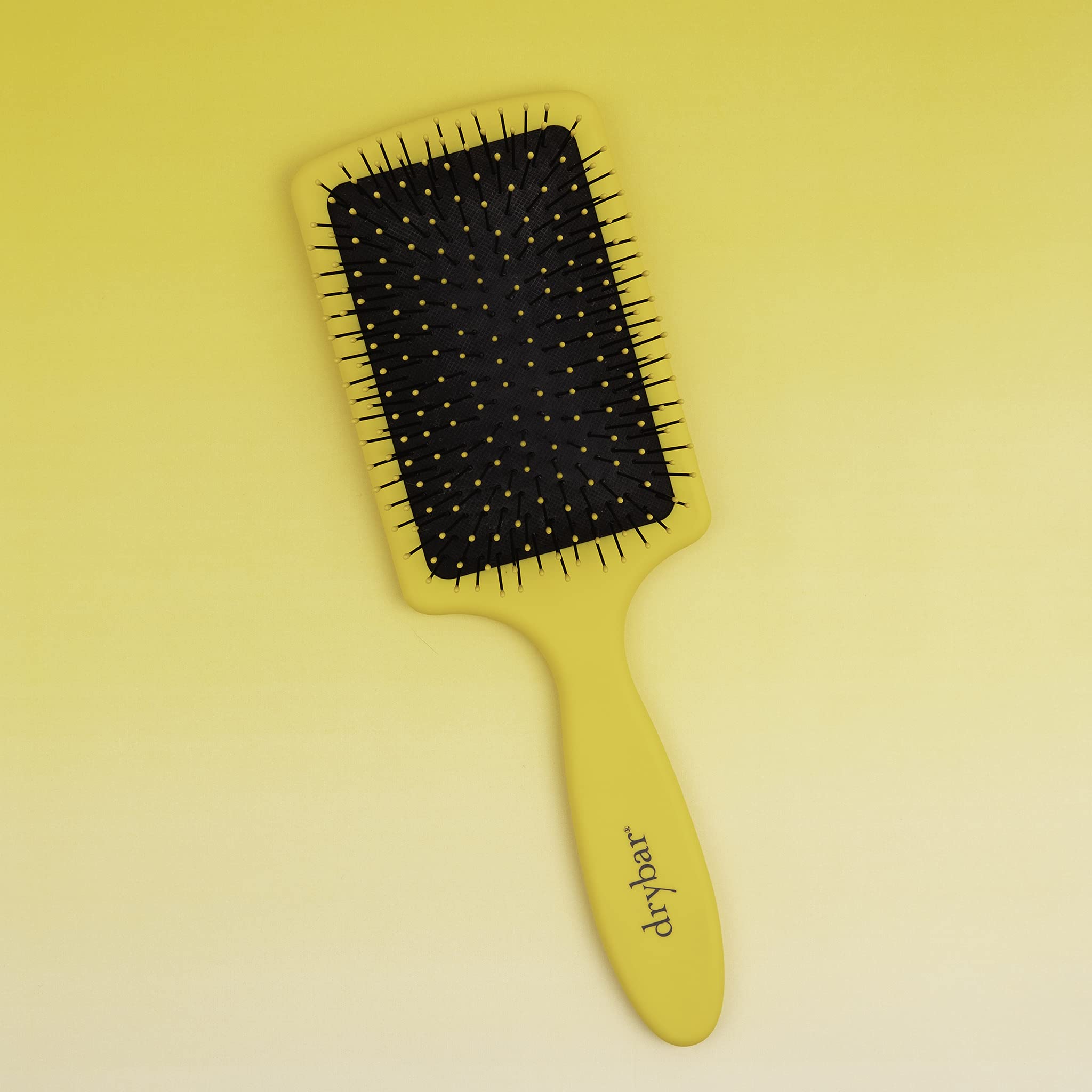 Drybar Lemon Bar Paddle Brush creates a sleek, shiny finish for a luxe blowout.