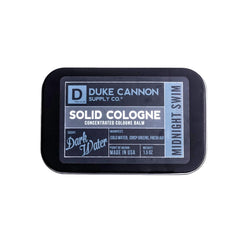 Duke Cannon Midnight Swim solid cologne bottle ready for on-the-go freshness.