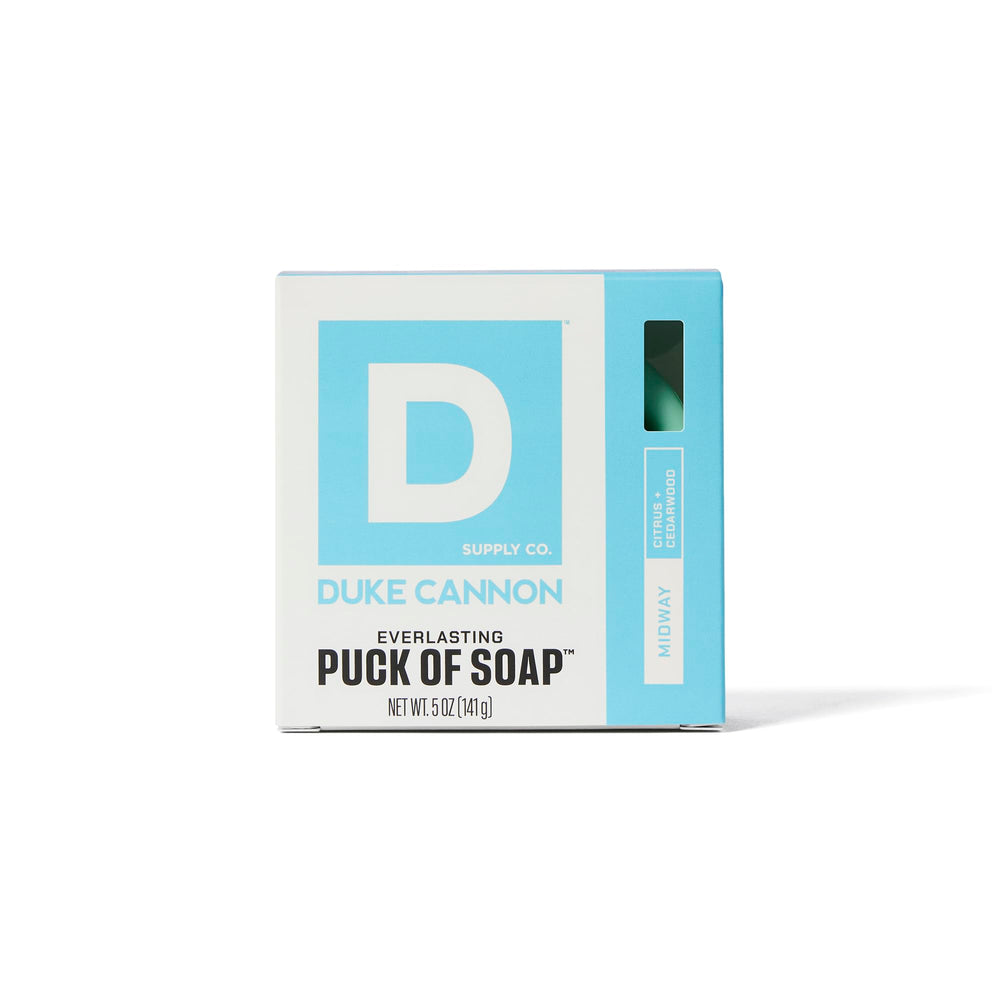 Duke Cannon Midway bar soap puck with citrus-sandalwood scent visible.