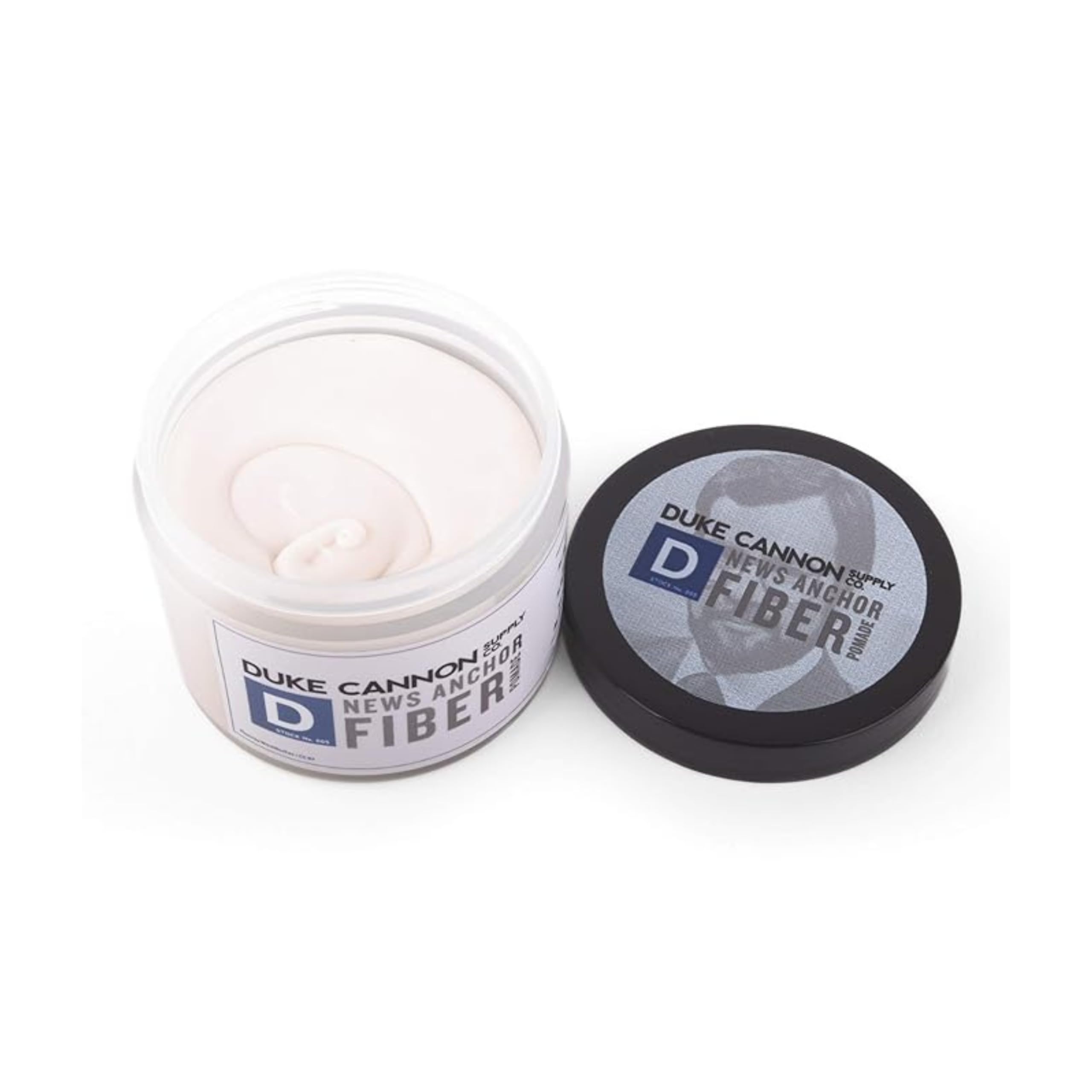 Duke Cannon News Anchor Pomade cedar sandalwood scent label evokes a clean masculine fragrance.
