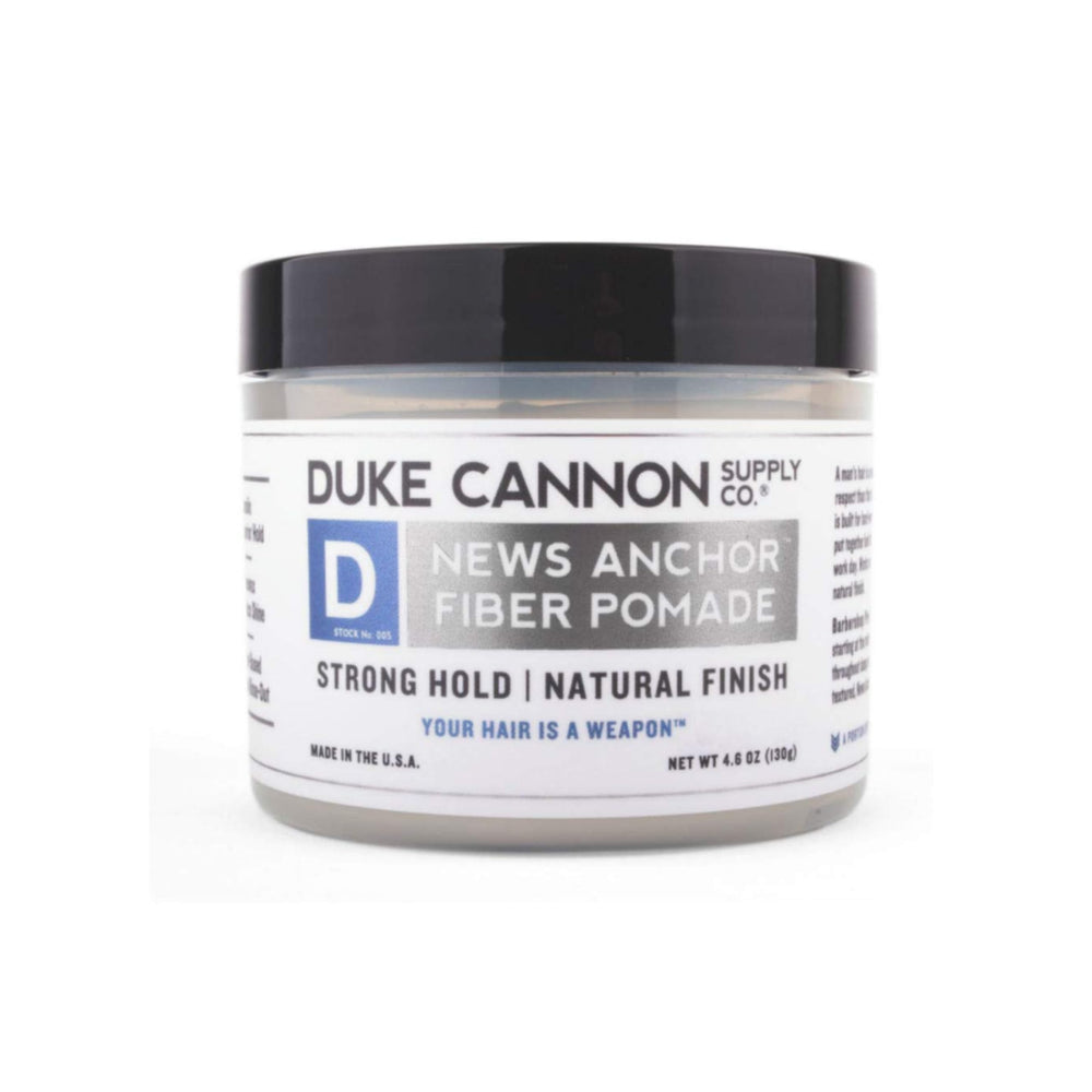 Duke Cannon News Anchor Pomade being rubbed between palms for easy application.