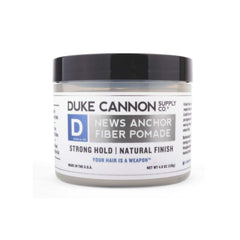 Duke Cannon News Anchor Pomade being rubbed between palms for easy application.