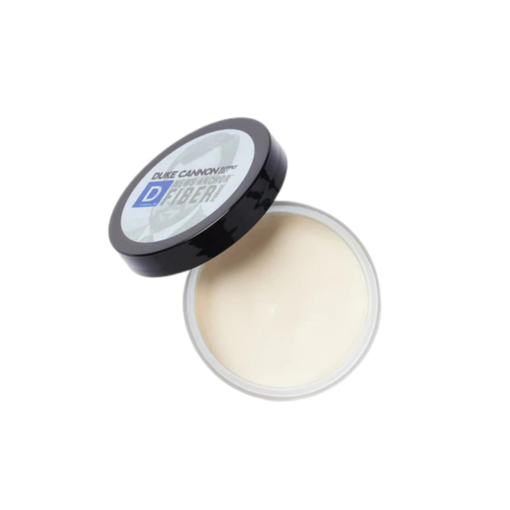 Duke Cannon News Anchor Pomade matte finish on hair for natural texture.