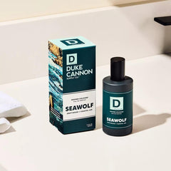 Glass bottle closeup highlights premium apothecary-style design and refined masculinity.