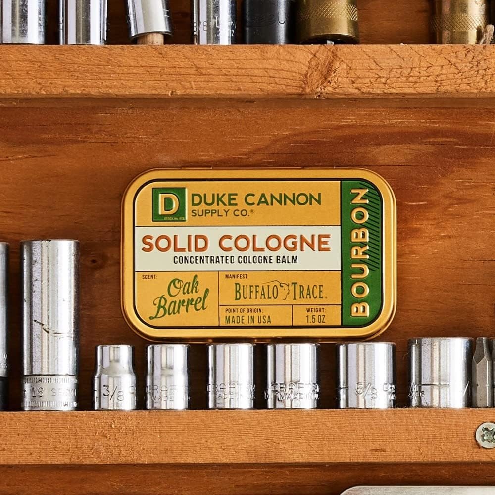 Duke Cannon solid cologne bourbon texture close-up, long-lasting fragrance on skin.