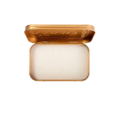 Duke Cannon bourbon solid cologne open tin, apply with fingertips for precise scent.
