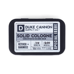 Duke Cannon solid cologne tin closed for travel and daily use.