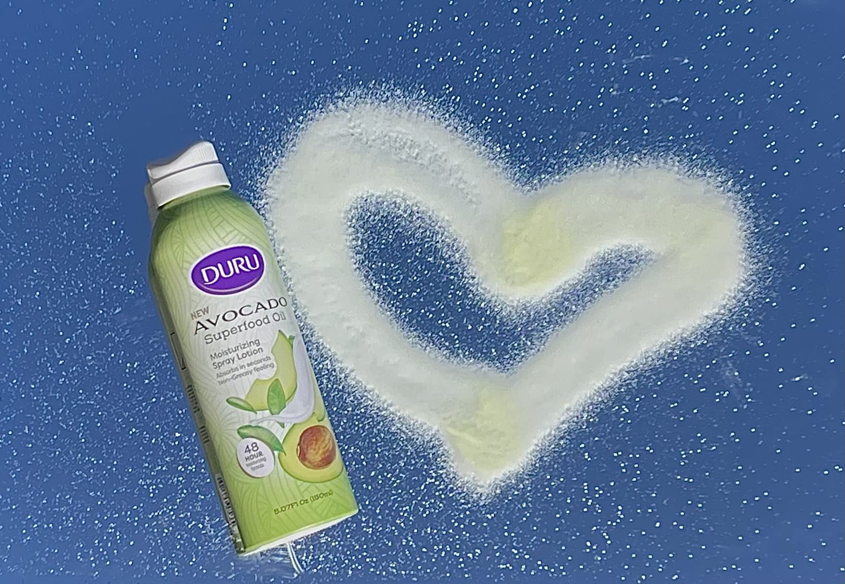 Close-up of spray mist providing quick, non-greasy absorption.