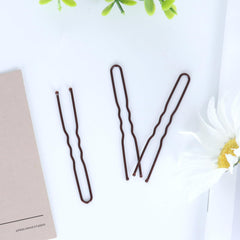 Dysalic brown U-shaped pins ideal for weddings or parties on all hair types.