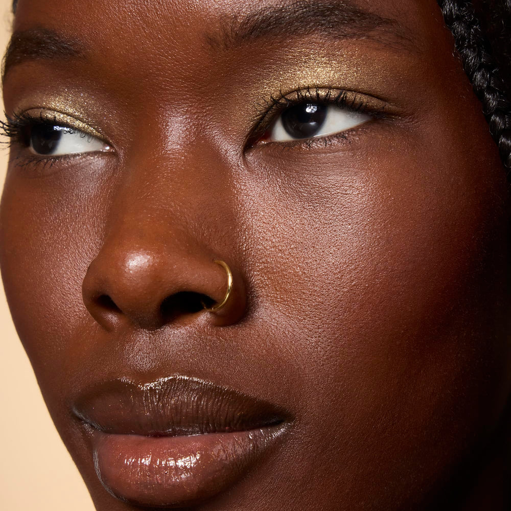 e.l.f. Fine as Fleck glitter eyeshadow layered with other shadows for party-ready dimension