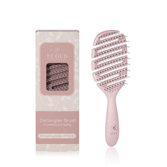Ecoed Detangler Hairbrush pink vented design promotes quick drying and smooth detangling.