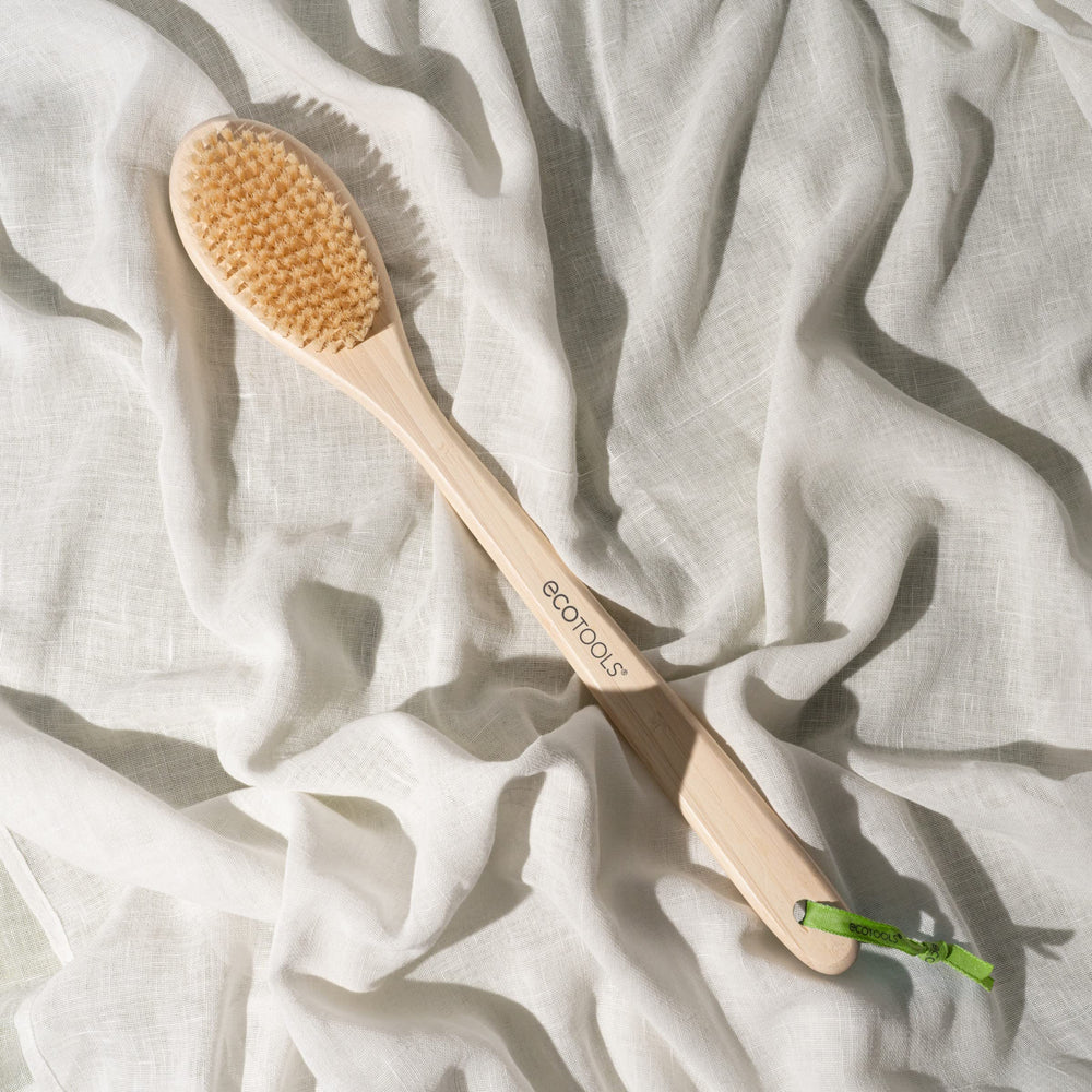 EcoTools Bath Bristle Brush hangs to dry with built-in ribbon