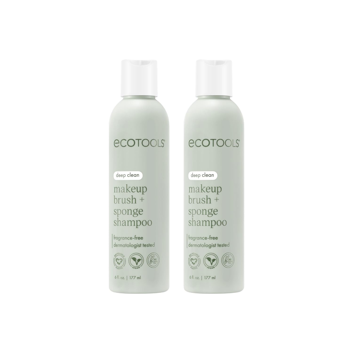 EcoTools brush shampoo two bottles on a clean vanity for smoother makeup application.