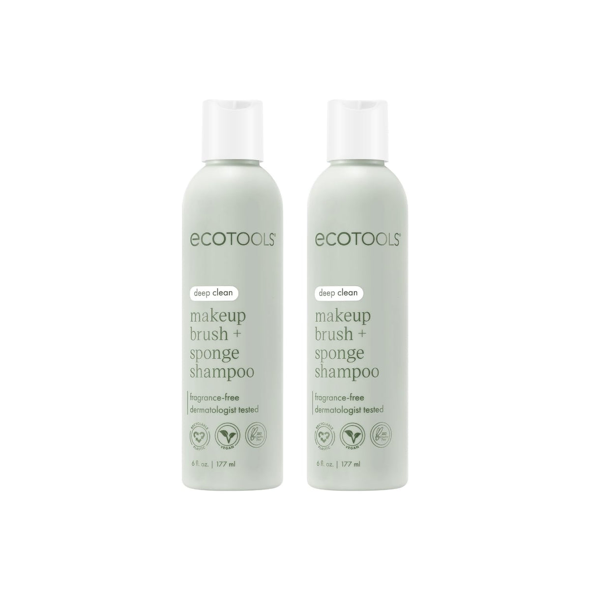 EcoTools brush shampoo two bottles on a clean vanity for smoother makeup application.
