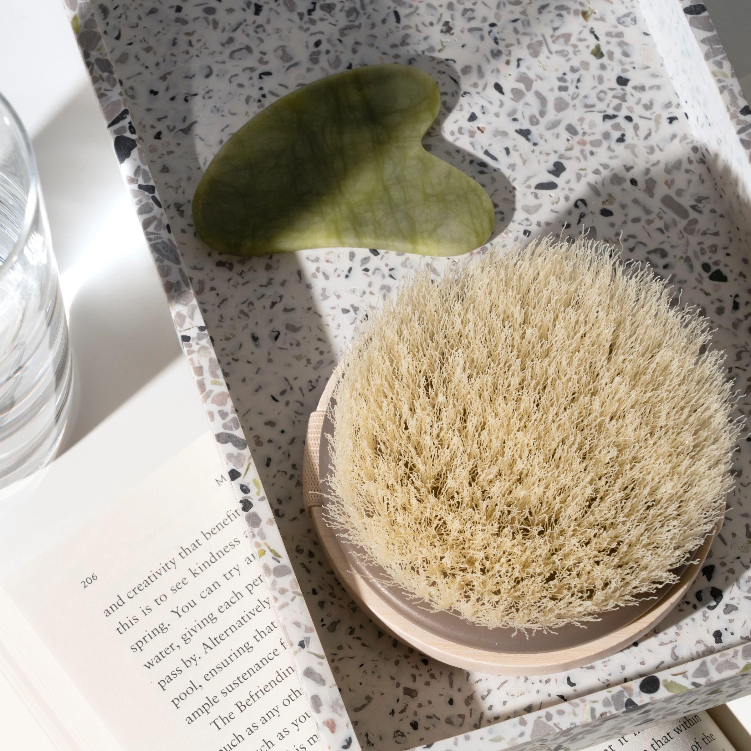 EcoTools dry body brush on legs demonstrates even coverage