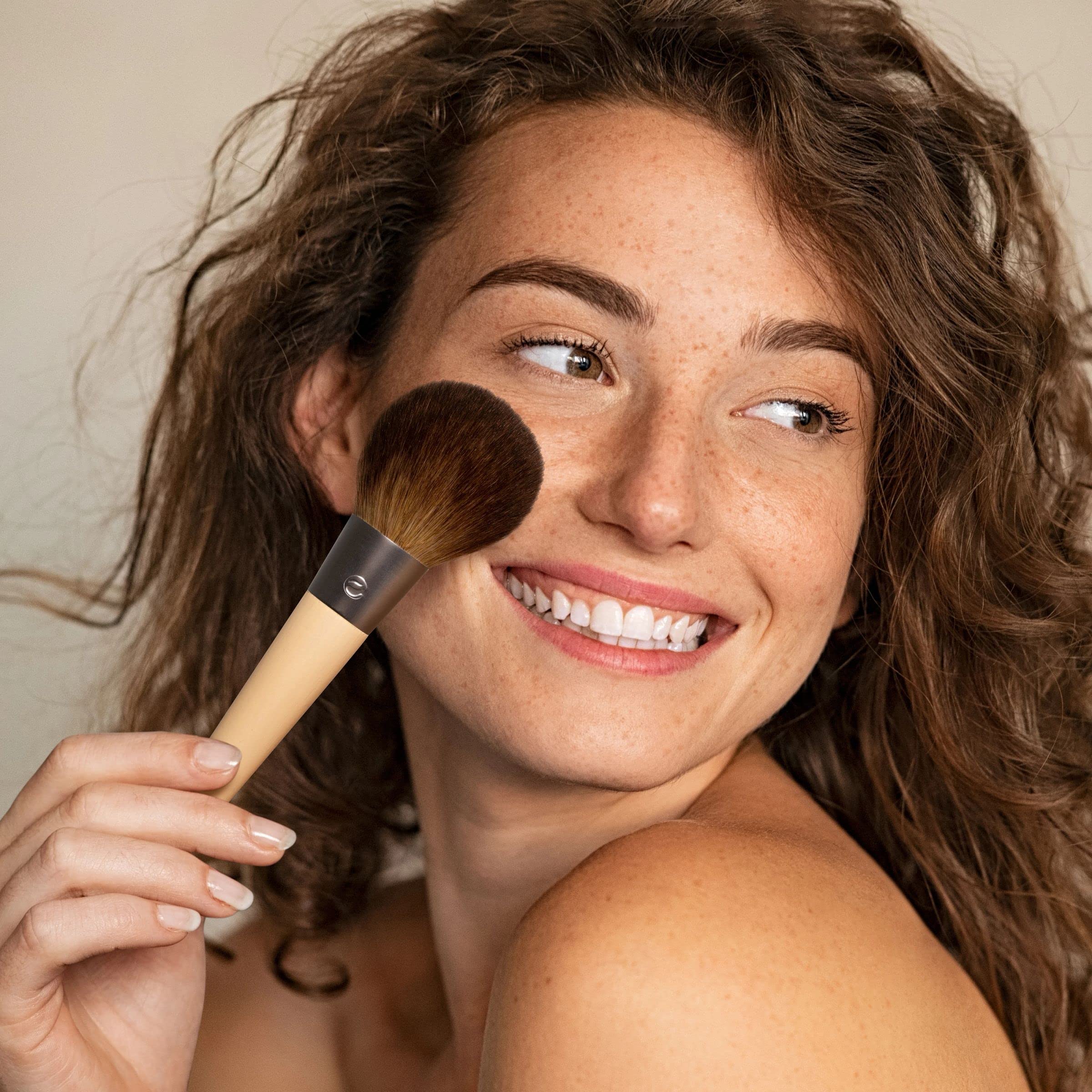 EcoTools Full Powder Brush with loose powder illustrates quick, natural setting.