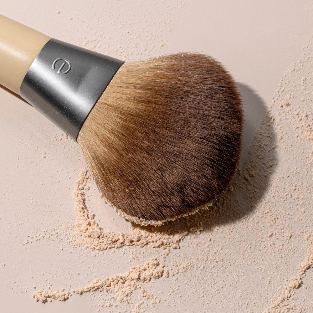EcoTools large brush in hand ready for all-over blending