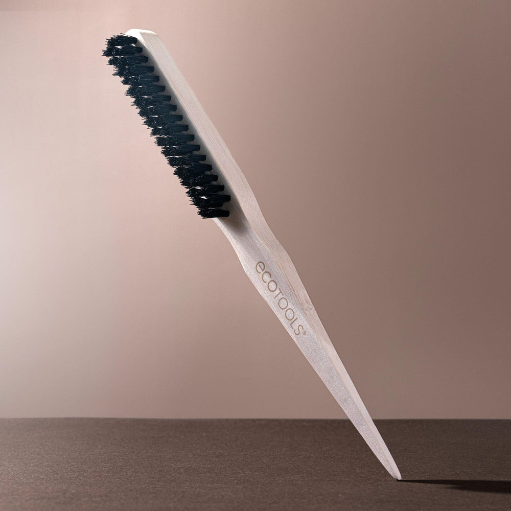 EcoTools Slick Back Brush no-slip grip on handle in hand