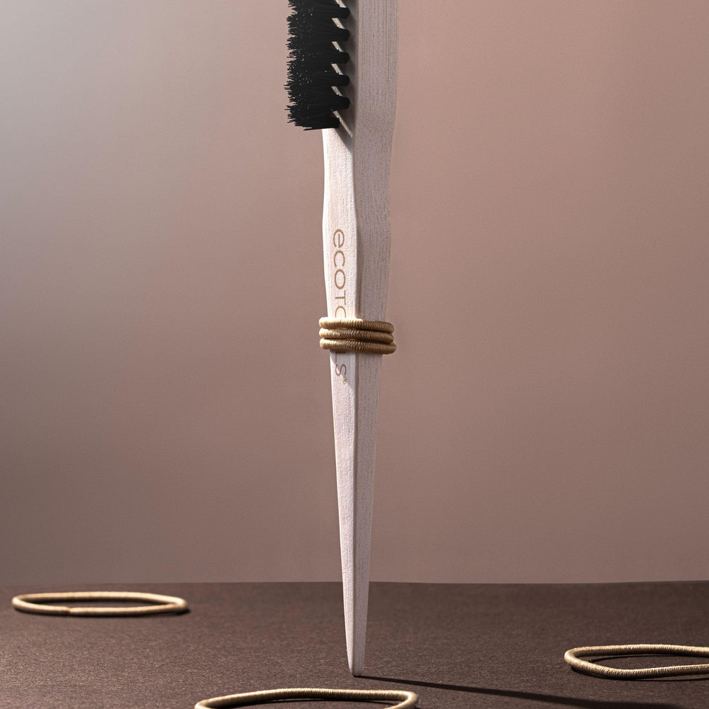 EcoTools Slick Back Brush distributing natural oils for shine
