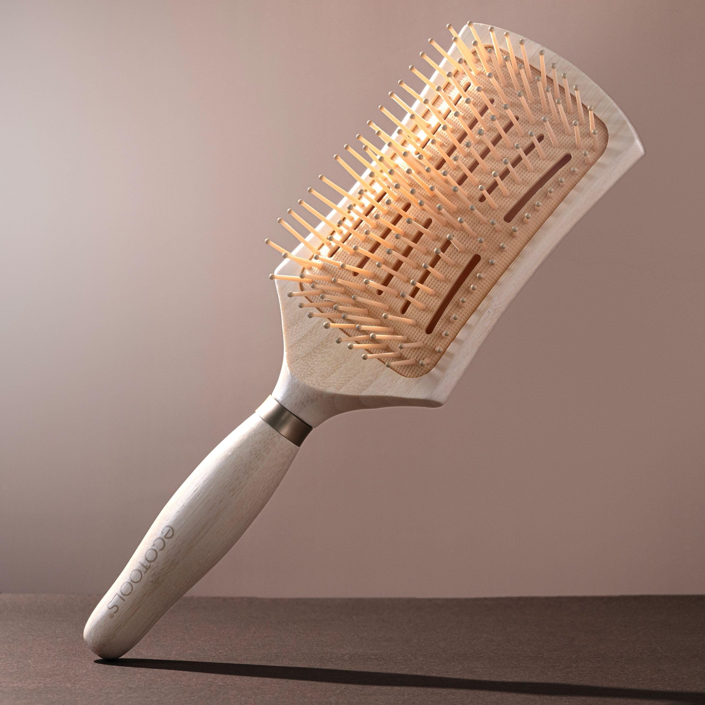Large paddle head designed for quick detangling of larger hair sections.