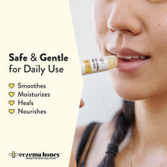 Applying Eczema Honey lip balm on lips for moisture